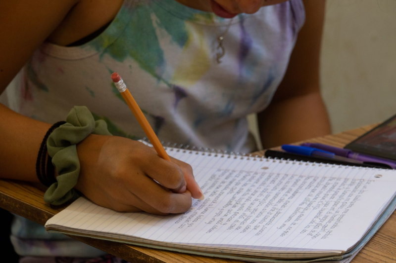 student writing during first Project 1:1000 Session